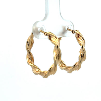 9ct yellow gold hoop earrings weighing 1.8g, stylish and lightweight jewelry by Reeves and Sons, shown in the product image.