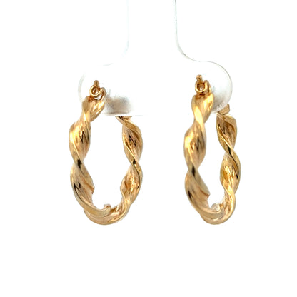 Reeves and Sons 9ct yellow gold hoop earrings, 1.8g, with a smooth polished finish, shown in close-up image.