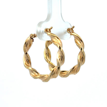 Reeves and Sons 9ct yellow gold hoop earrings, lightweight 1.8g, with smooth polished finish, shown on a plain background.