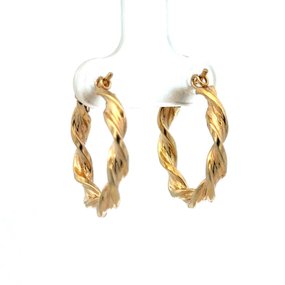 9ct yellow gold hoop earrings by Reeves and Sons, lightweight 1.8g, showcasing classic circular design and polished finish.