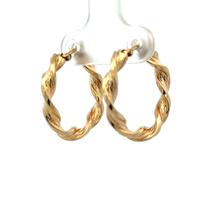 9ct yellow gold hoop earrings weighing 1.8g, featuring a classic circular design from Reeves and Sons.