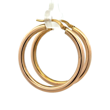 9ct yellow gold hoop earrings by Reeves and Sons, 1.8g, showcasing smooth, polished hoops with a secure clasp.