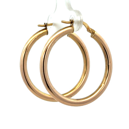 9ct yellow gold hoop earrings by Reeves and Sons, lightweight 1.8g, showcasing classic round hoop design and polished finish.