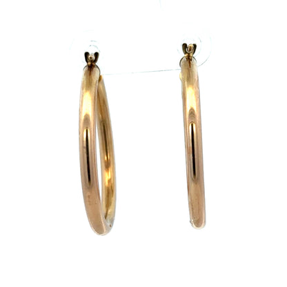 9ct yellow gold hoop earrings weighing 1.8g, stylish and lightweight jewelry from Reeves and Sons, shown in close-up image.