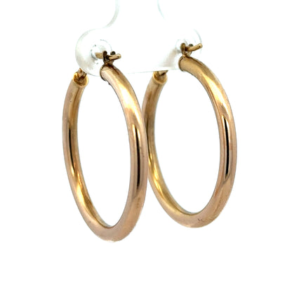 9ct yellow gold hoop earrings weighing 1.8g, featuring a classic circular design by Reeves and Sons.