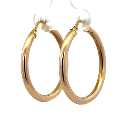 9ct yellow gold hoop earrings weighing 1.8g featuring classic circular design by Reeves and Sons.
