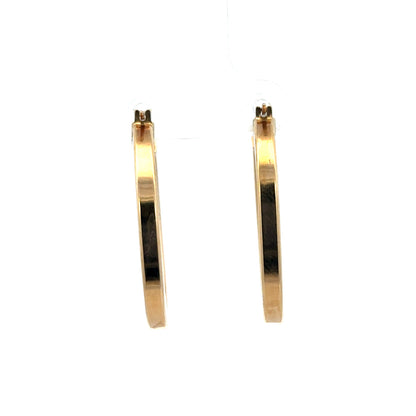 9ct yellow gold hoop earrings from Reeves and Sons, lightweight 2.1g, featuring a classic circular design with a secure clasp.