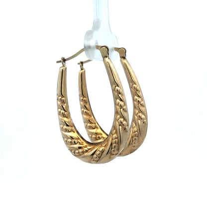 9ct yellow gold hoop earrings by Reeves and Sons, lightweight 1.7g, showcasing classic circular design and polished finish.