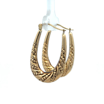 9ct yellow gold hoop earrings with a polished finish, weighing 1.7g, from Reeves and Sons, shown on a plain background.