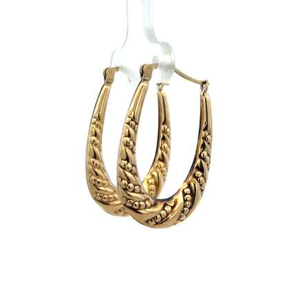 Reeves and Sons 9ct yellow gold hoop earrings, lightweight 1.7g, featuring a classic circular design, close-up view.