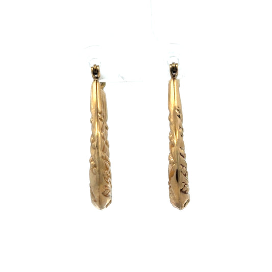 9ct yellow gold hoop earrings from Reeves and Sons, lightweight jewelry with a classic circular design, shown from front view.