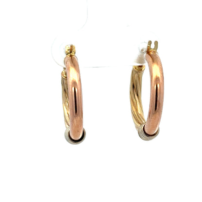 9ct gold hoop earrings weighing 2.2g by Reeves and Sons, close-up of shiny, circular jewelry on a white background.