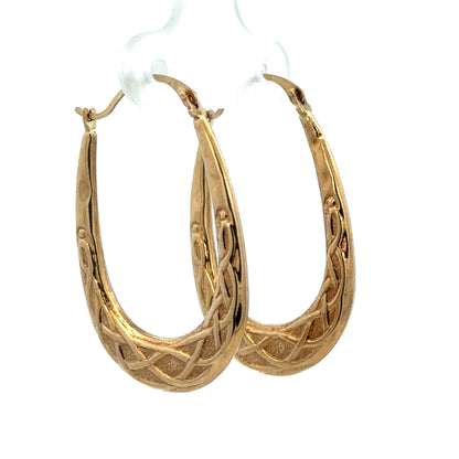 9ct yellow gold hoop earrings from Reeves and Sons, lightweight and polished with a classic circular design.