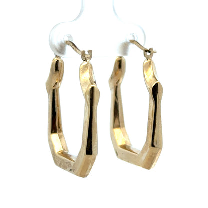 9ct yellow gold hoop earrings weighing 2.2g, stylish and polished, designed by Reeves and Sons.