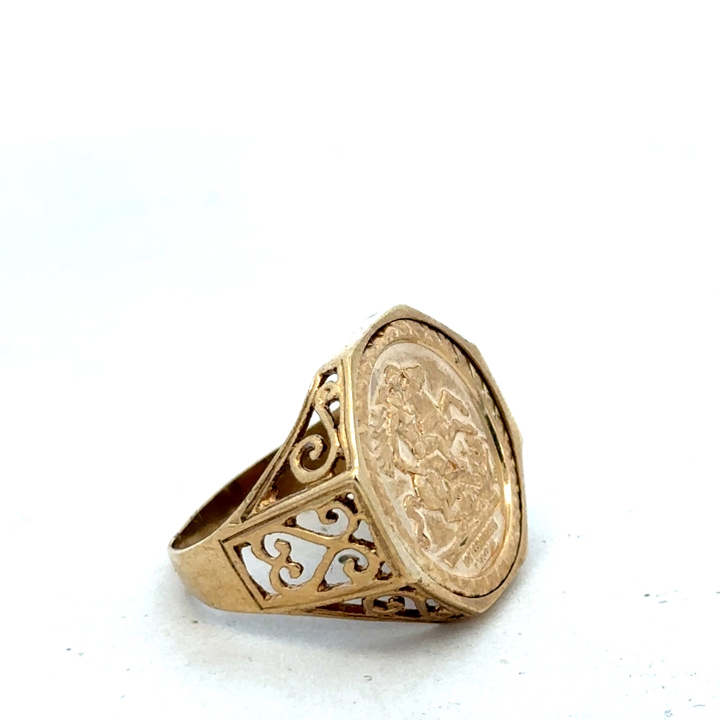 9ct yellow gold St George ring in size T with detailed engraved design, crafted by Reeves and Sons.