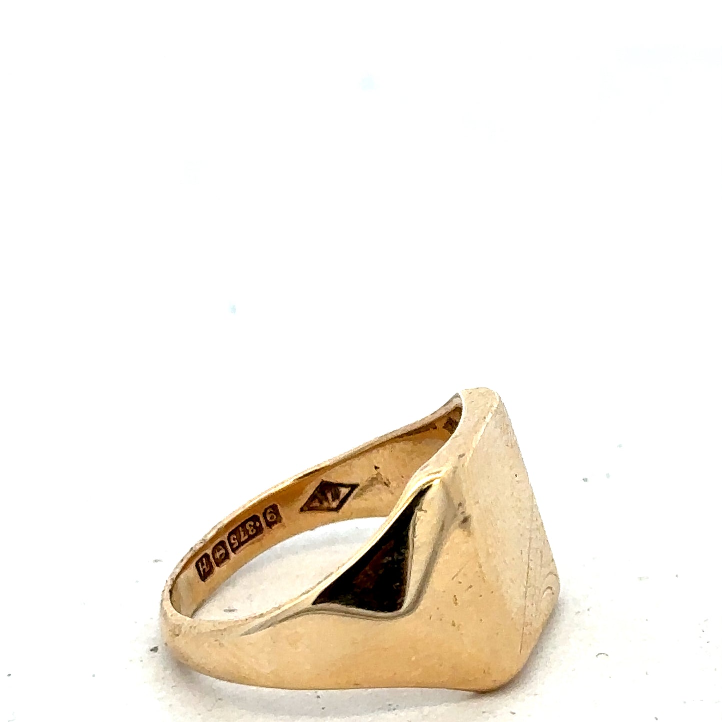 9ct yellow gold signet ring in size P1/2 from Reeves and Sons, featuring a smooth polished finish and classic design.