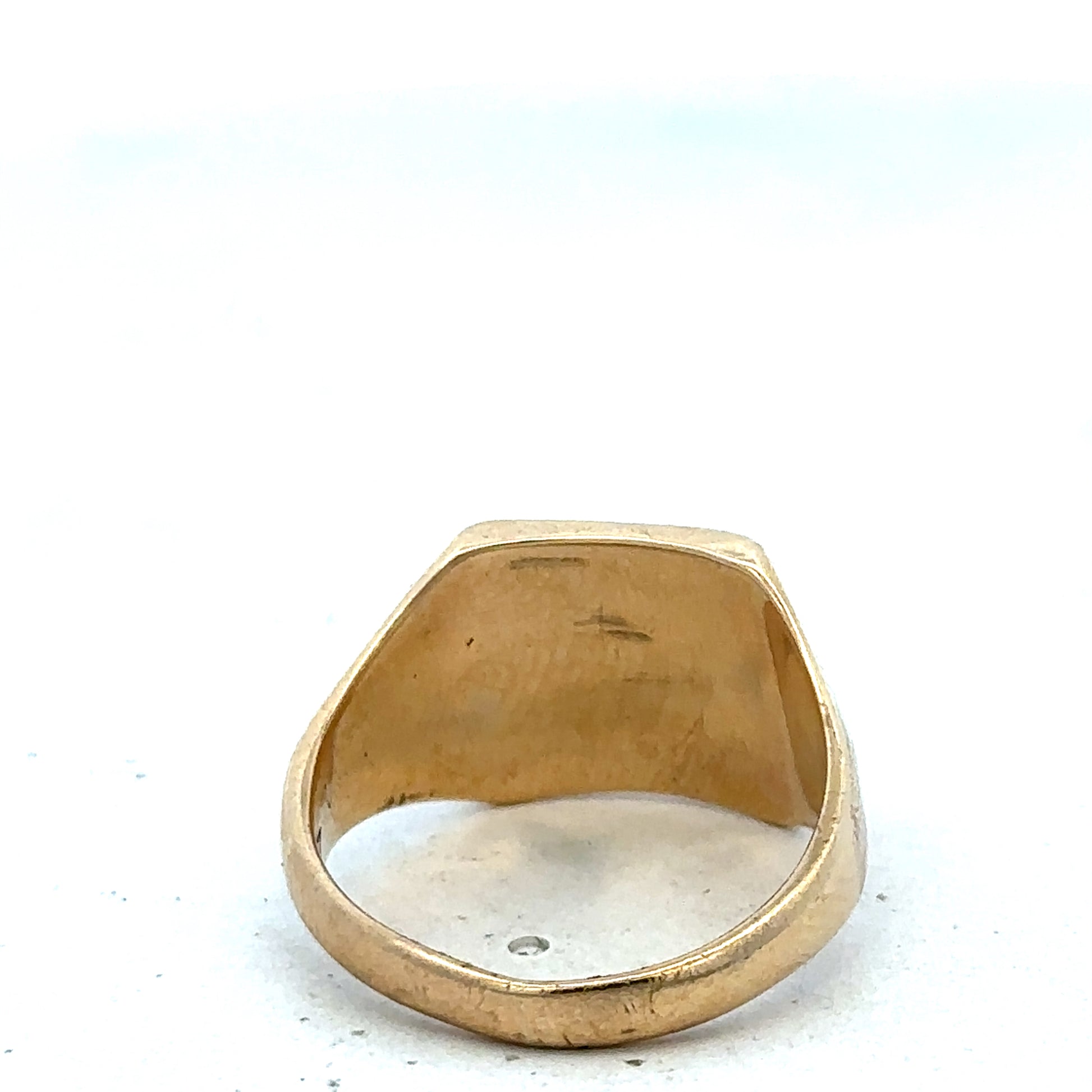 9ct yellow gold signet ring in size P1/2, Reeves and Sons, featuring a smooth polished surface and classic design.