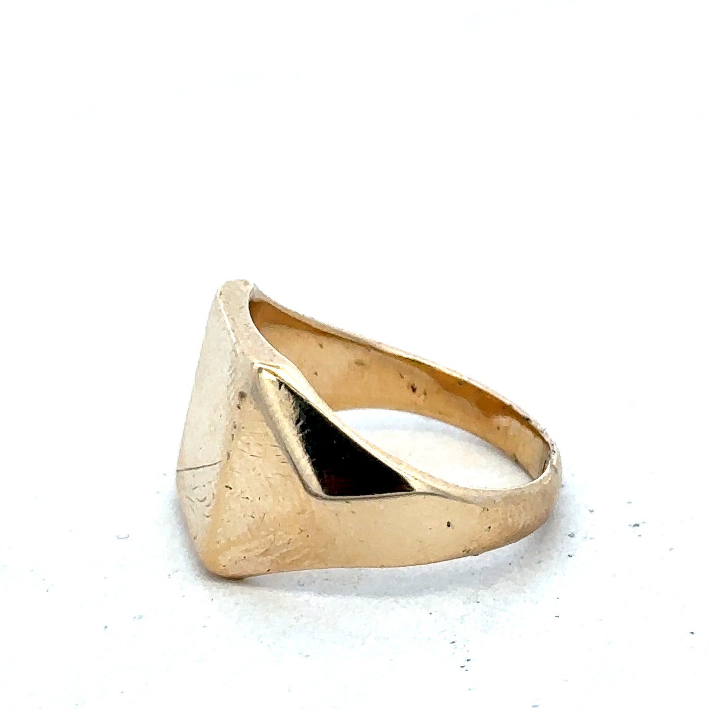 9ct yellow gold signet ring in size P1/2 by Reeves and Sons, showcasing a polished, classic design with smooth finish.