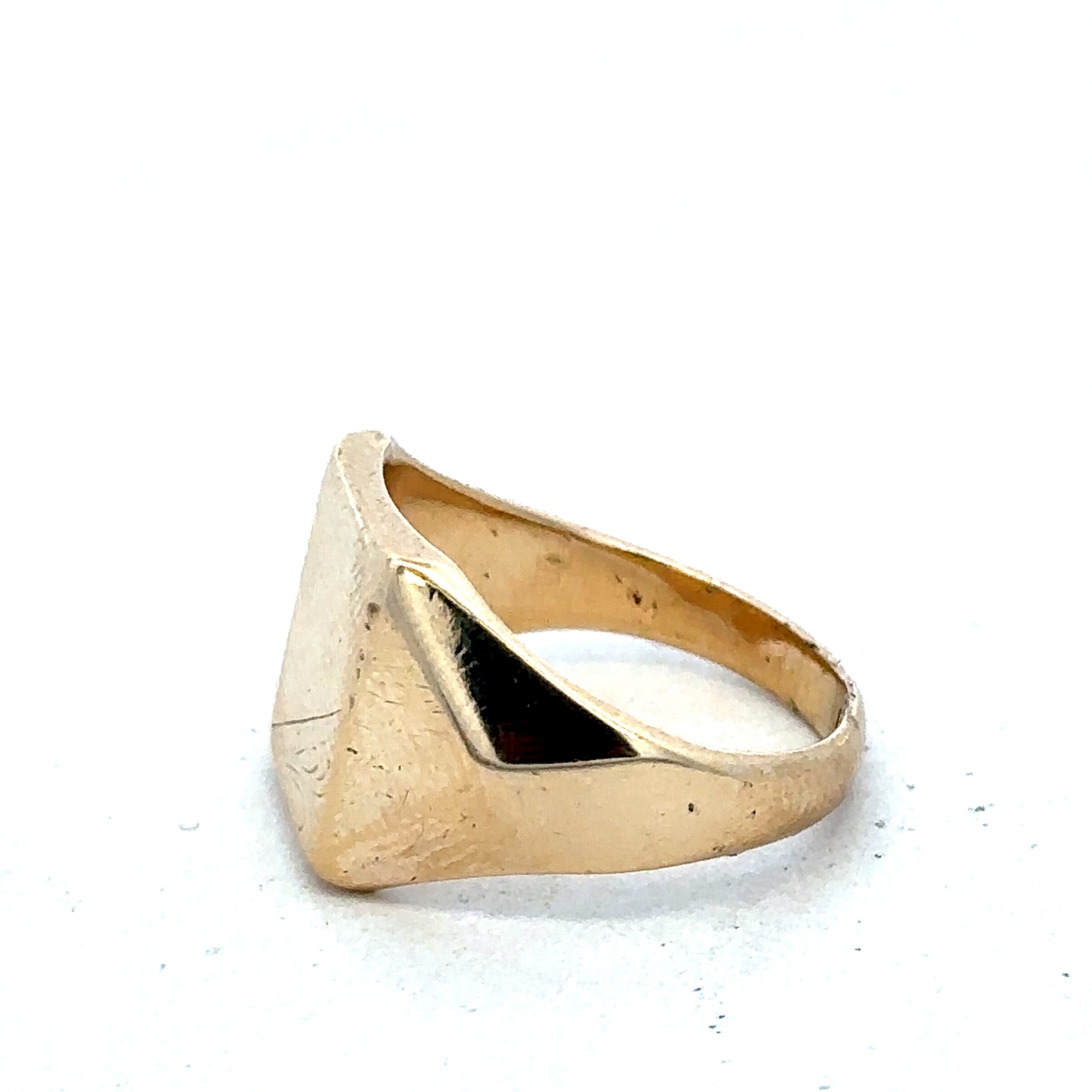 9ct yellow gold signet ring in size P1/2 by Reeves and Sons, showcasing a polished, classic design with smooth finish.