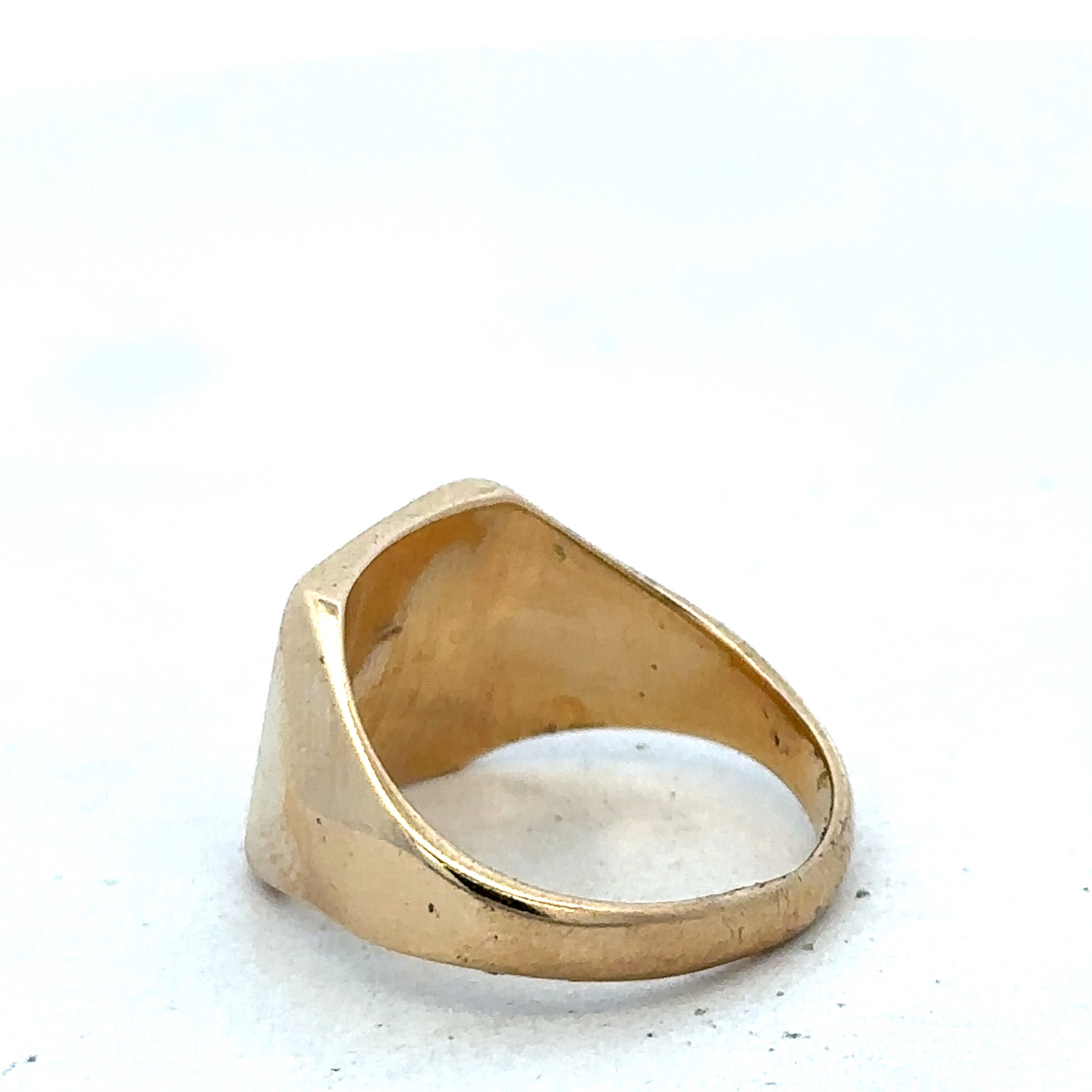9ct yellow gold signet ring in size P1/2 with Reeves and Sons branding, showcasing a smooth, polished surface and classic design.
