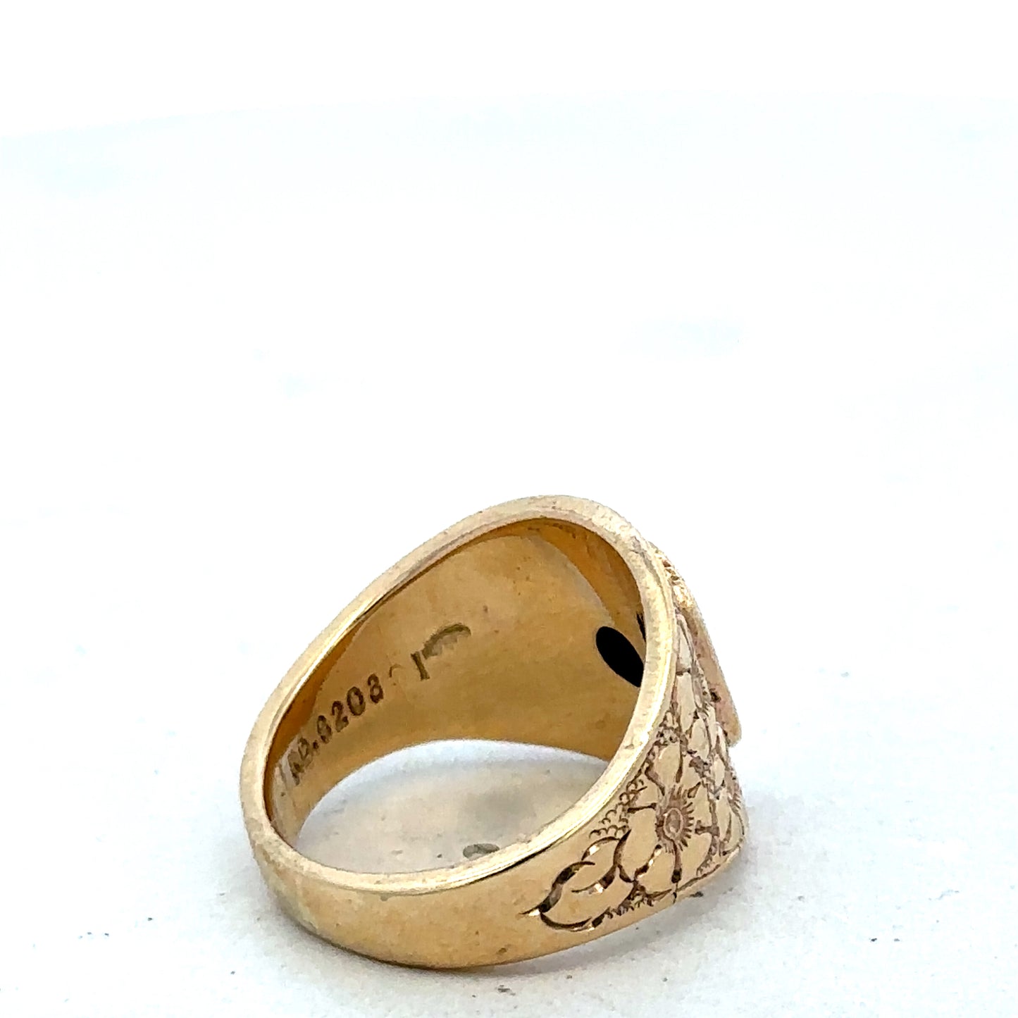 9ct yellow gold ring size L by Reeves and Sons, close-up of polished band with smooth finish.