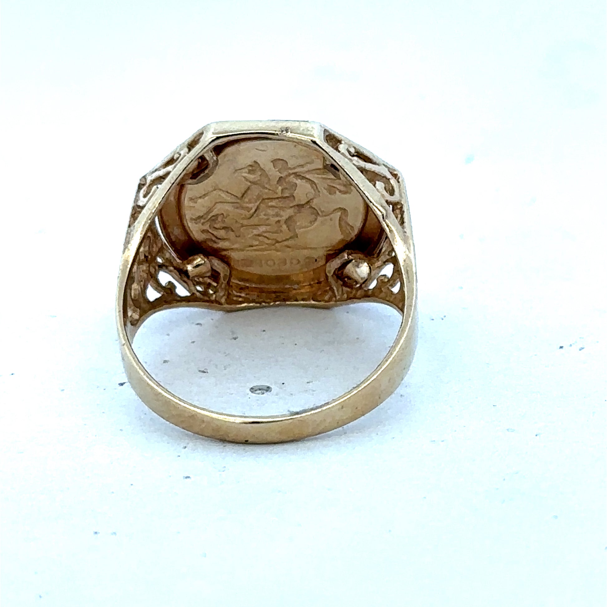 9ct yellow gold St George ring size T with engraved design, crafted by Reeves and Sons, displayed on a neutral background
