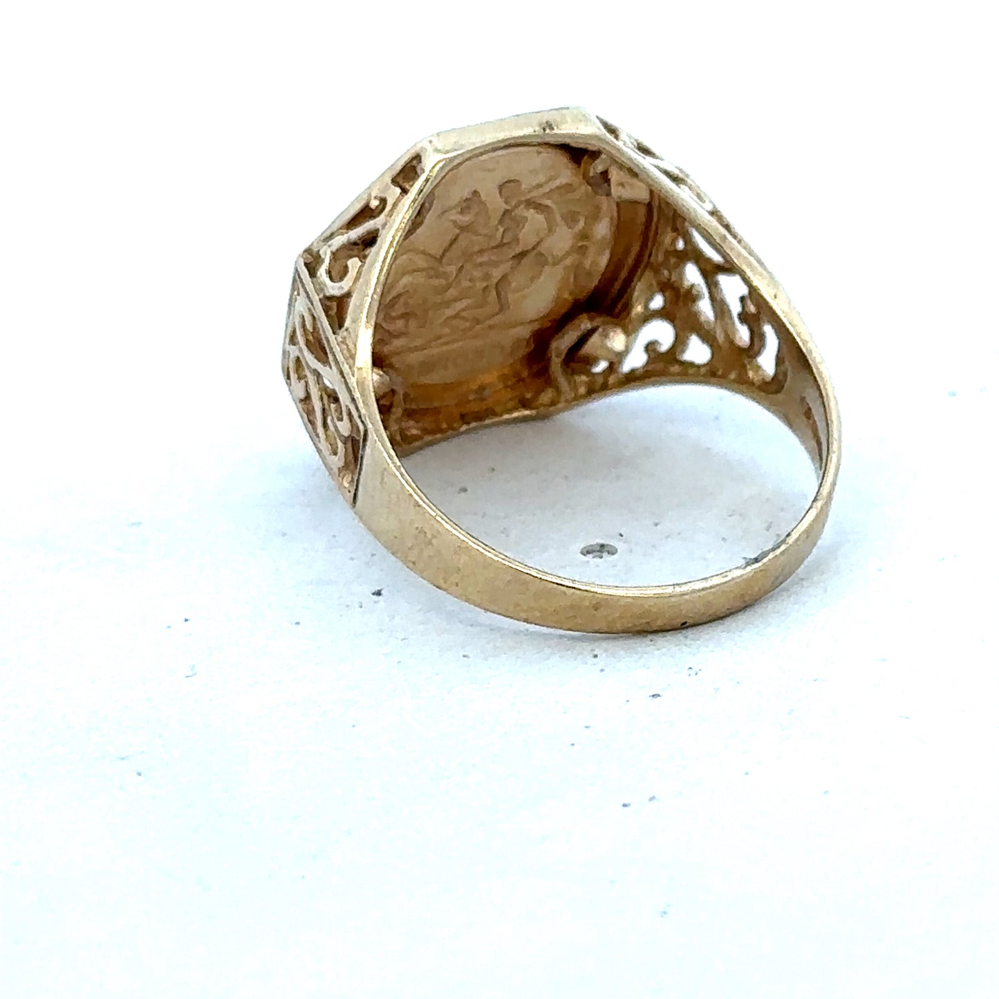 9ct yellow gold St George ring in size T with intricate design, crafted by Reeves and Sons.