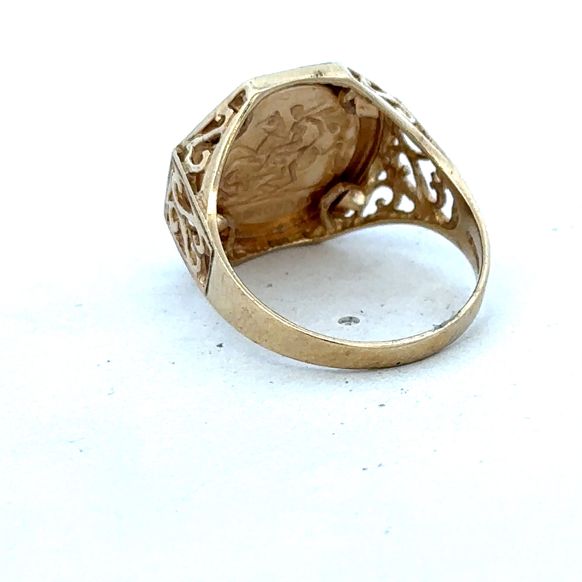 9ct yellow gold St George ring in size T with intricate design, crafted by Reeves and Sons.