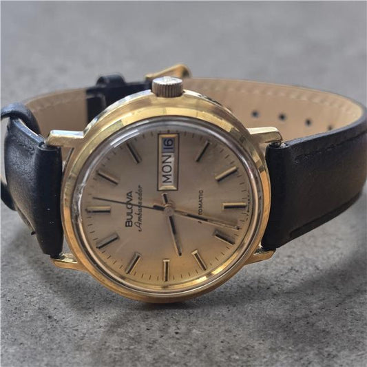 Bulova plated automatic watch with a sleek design, weighing 44.9g, showcasing the elegant timepiece in the image.