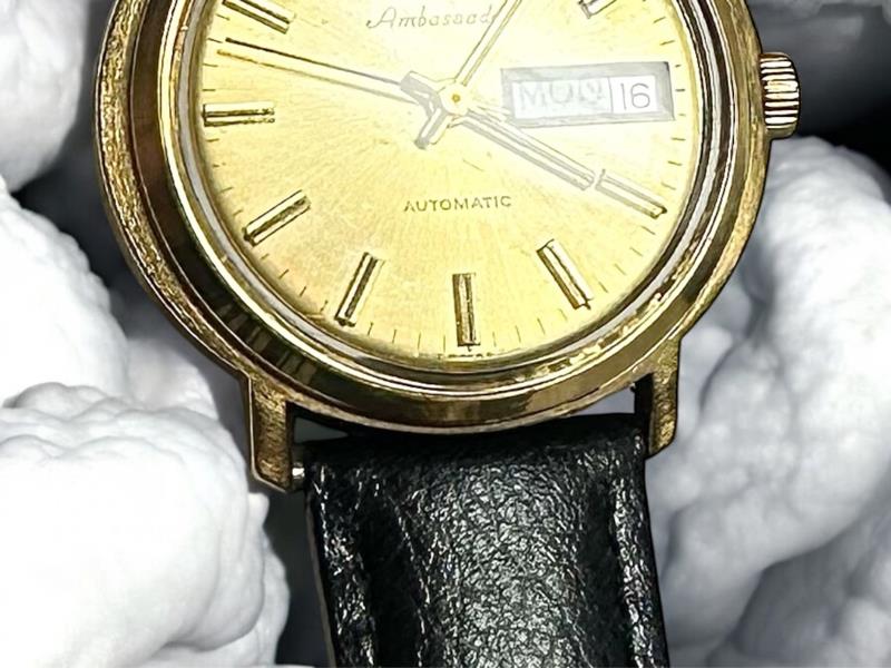 Bulova plated automatic watch with a sleek design and visible dial, weighing 44.9g, showcasing luxury watch craftsmanship.