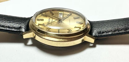 Bulova plated automatic watch with a sleek design, weighing 44.9g, featuring a stainless steel case and a classic dial.