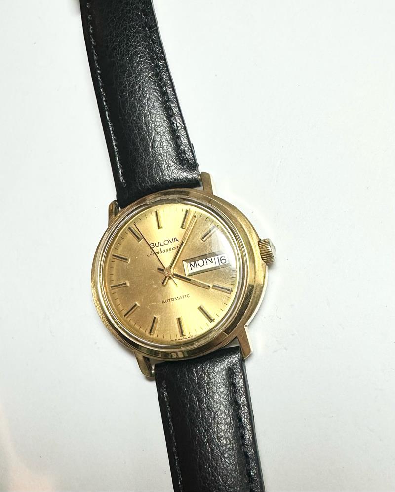 Bulova plated automatic watch with a sleek design, weighing 44.9g, showcasing its elegant timepiece features.