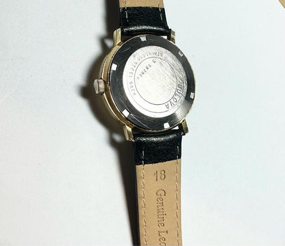 Bulova plated automatic watch with stainless steel band, 44.9g, featuring a sleek design and classic timepiece look.