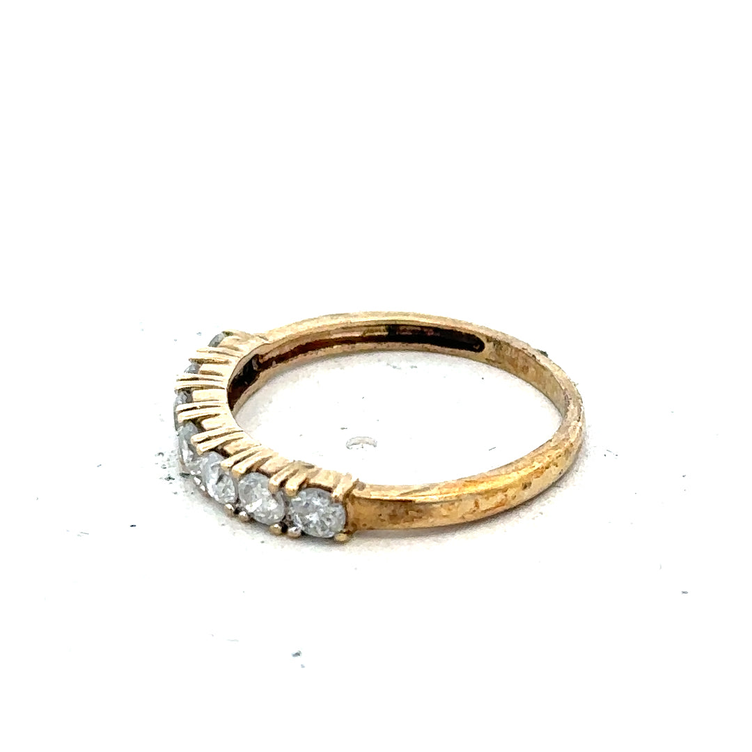 9ct half-carat diamond eternity ring by Carat featuring a continuous row of sparkling diamonds on a sleek band.