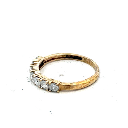 9ct half-carat diamond eternity ring by Carat featuring a continuous row of sparkling diamonds on a sleek band.