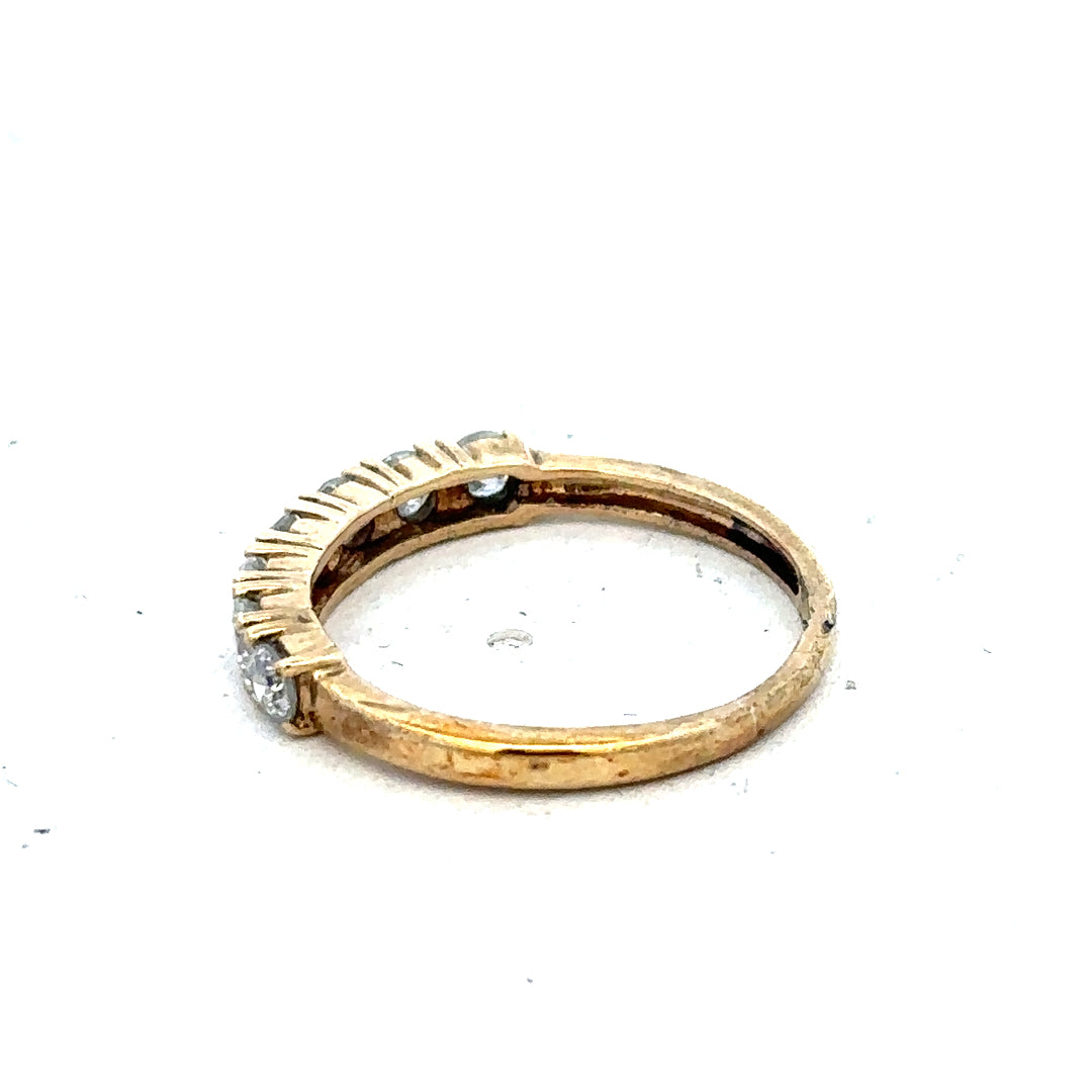 Carat 9ct gold half-carat diamond eternity ring featuring a continuous row of sparkling diamonds on a sleek band.