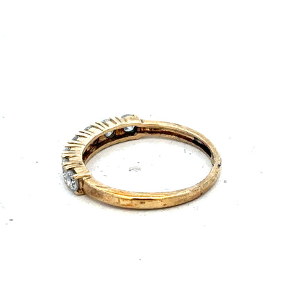 Carat 9ct gold half-carat diamond eternity ring featuring a continuous row of sparkling diamonds on a sleek band.
