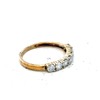 9ct half-carat diamond eternity ring by Carat, featuring a continuous row of sparkling diamonds on a sleek gold band.