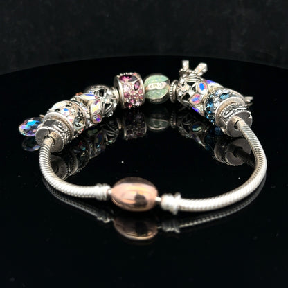 925 silver Chamilia charm bracelet featuring intricate charms and a secure clasp, crafted by Chamilia for elegant wear.