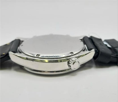 Citizen WR100 Eco-Drive watch with black strap and silver dial, showcasing sleek design and durable construction.
