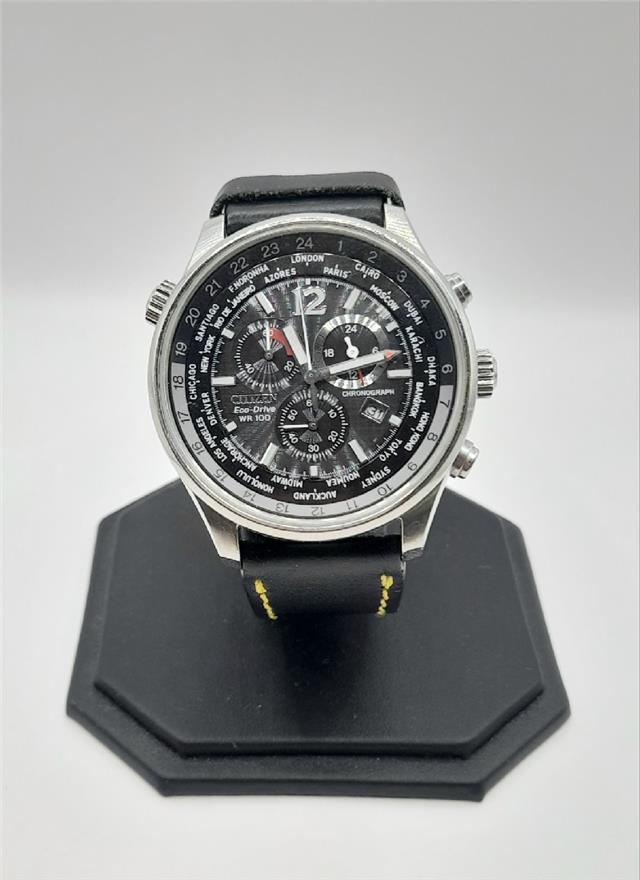 Citizen WR100 Eco-Drive watch with black dial and stainless steel band, featuring a sleek, modern design.