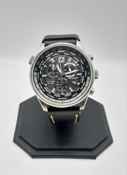 Citizen WR100 Eco-Drive watch with black dial and stainless steel band, featuring a sleek, modern design.