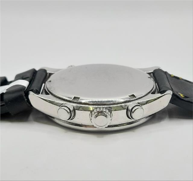 Citizen WR100 Eco-Drive watch with black dial and stainless steel band, showcasing a sleek, modern design.