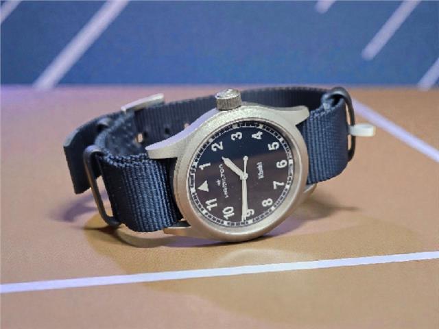 Hamilton Khaki watch Age 2025 with black dial, stainless steel case, and leather strap, showcasing a classic, military-inspired design.