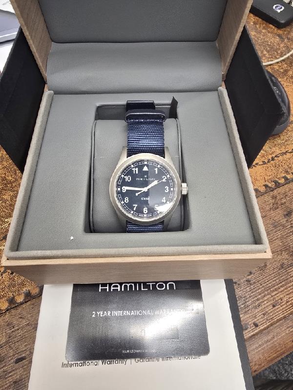 Hamilton Khaki Watch Age 2025, men's wristwatch with black dial, stainless steel case, and rugged design.