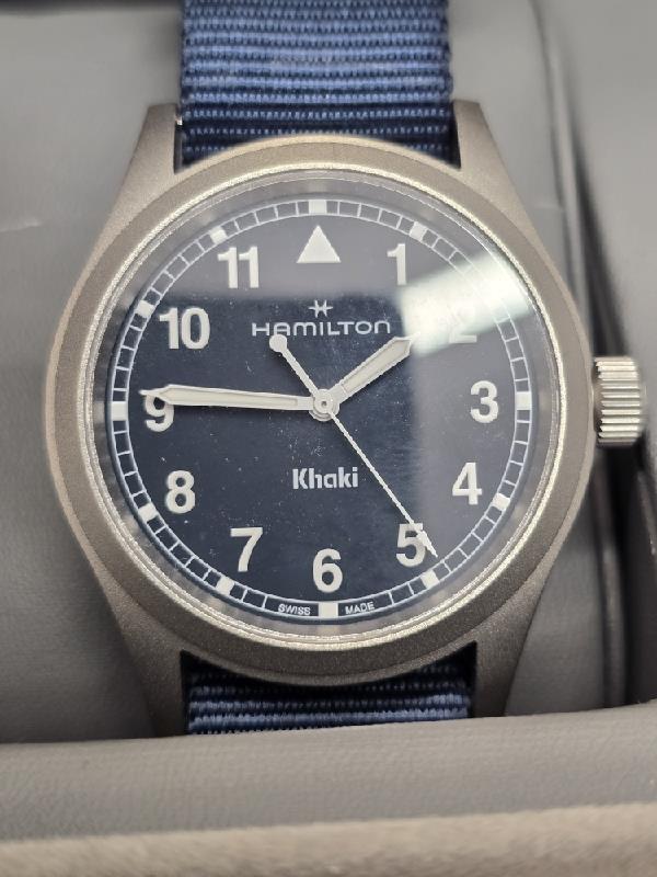 Hamilton Khaki watch Age 2025 with a black dial, stainless steel case, and military-inspired design.
