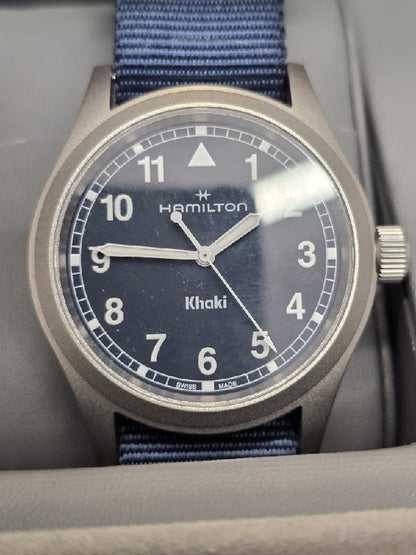 Hamilton Khaki watch Age 2025 with a black dial, stainless steel case, and military-inspired design.
