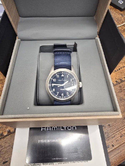 Hamilton Khaki watch Age 2025, men's wristwatch with black dial, stainless steel case, and NATO strap.
