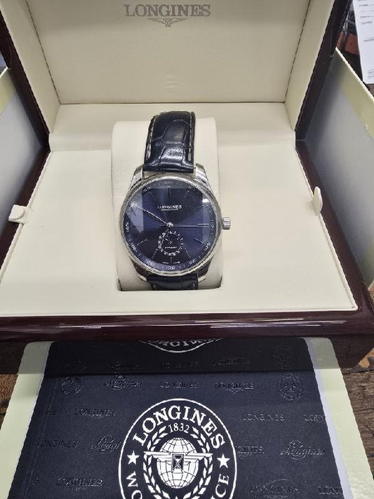 Longines Master Collection watch with boxed papers, featuring a classic design and stainless steel case.