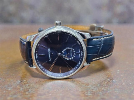 Longines Master Collection watch with boxed papers, featuring a classic design and stainless steel case.
